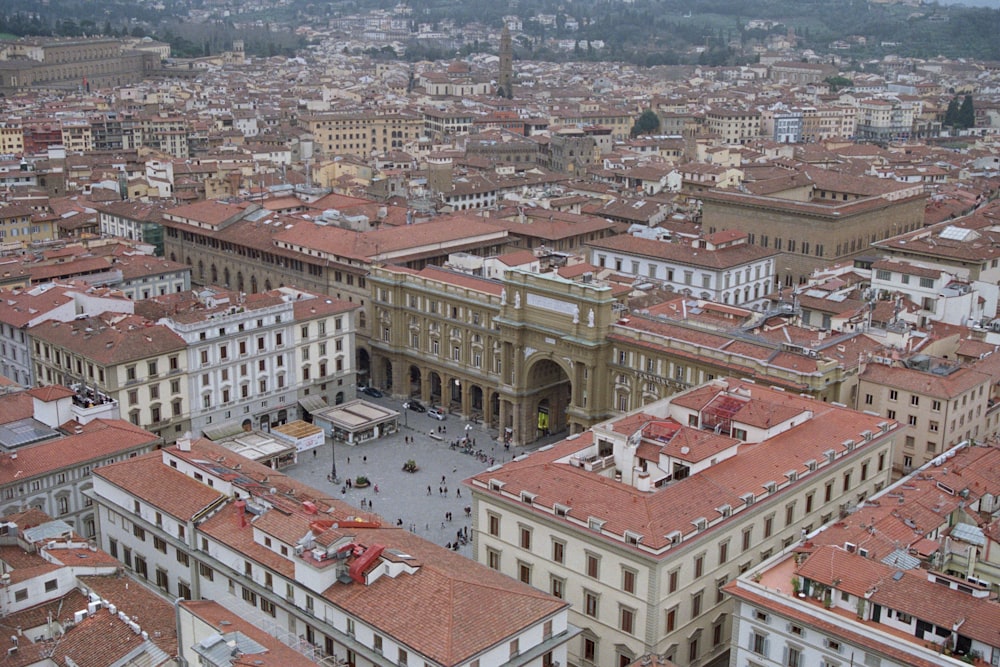 an aerial view of a city with many buildings