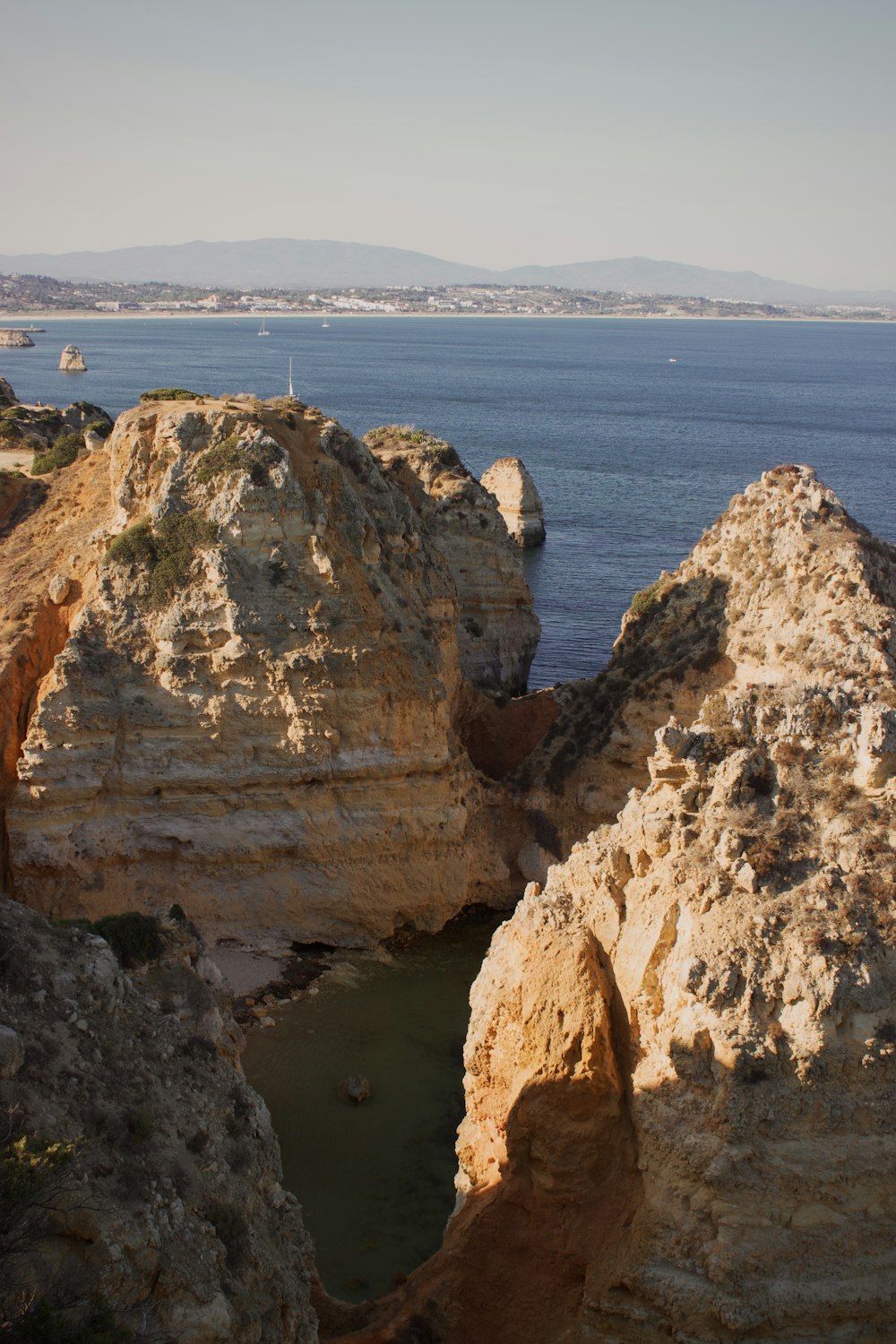 a view of a body of water from a cliff