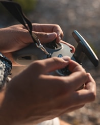 a person holding a cell phone in their hands