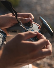 a person holding a cell phone in their hands