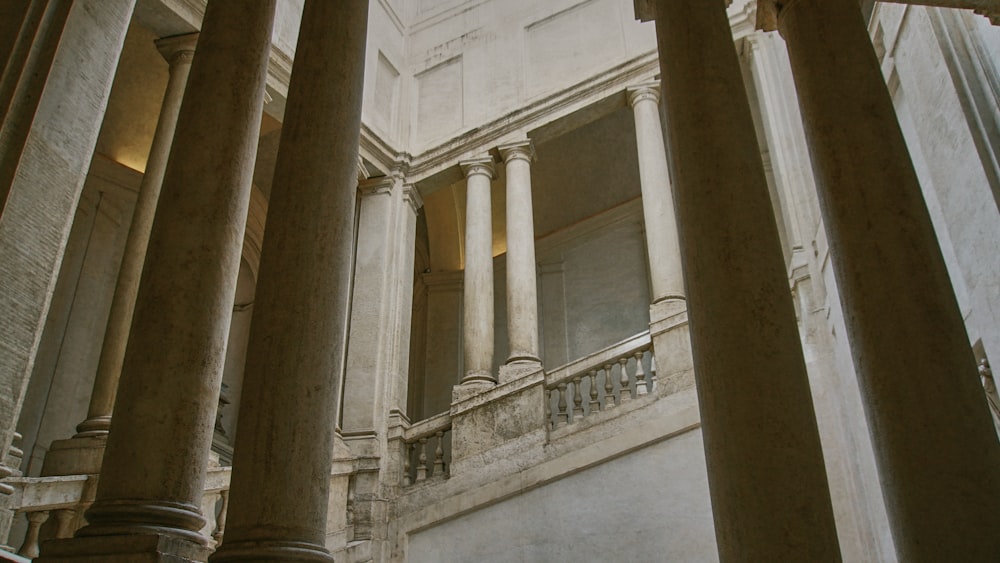 a large building with columns and a clock on the wall