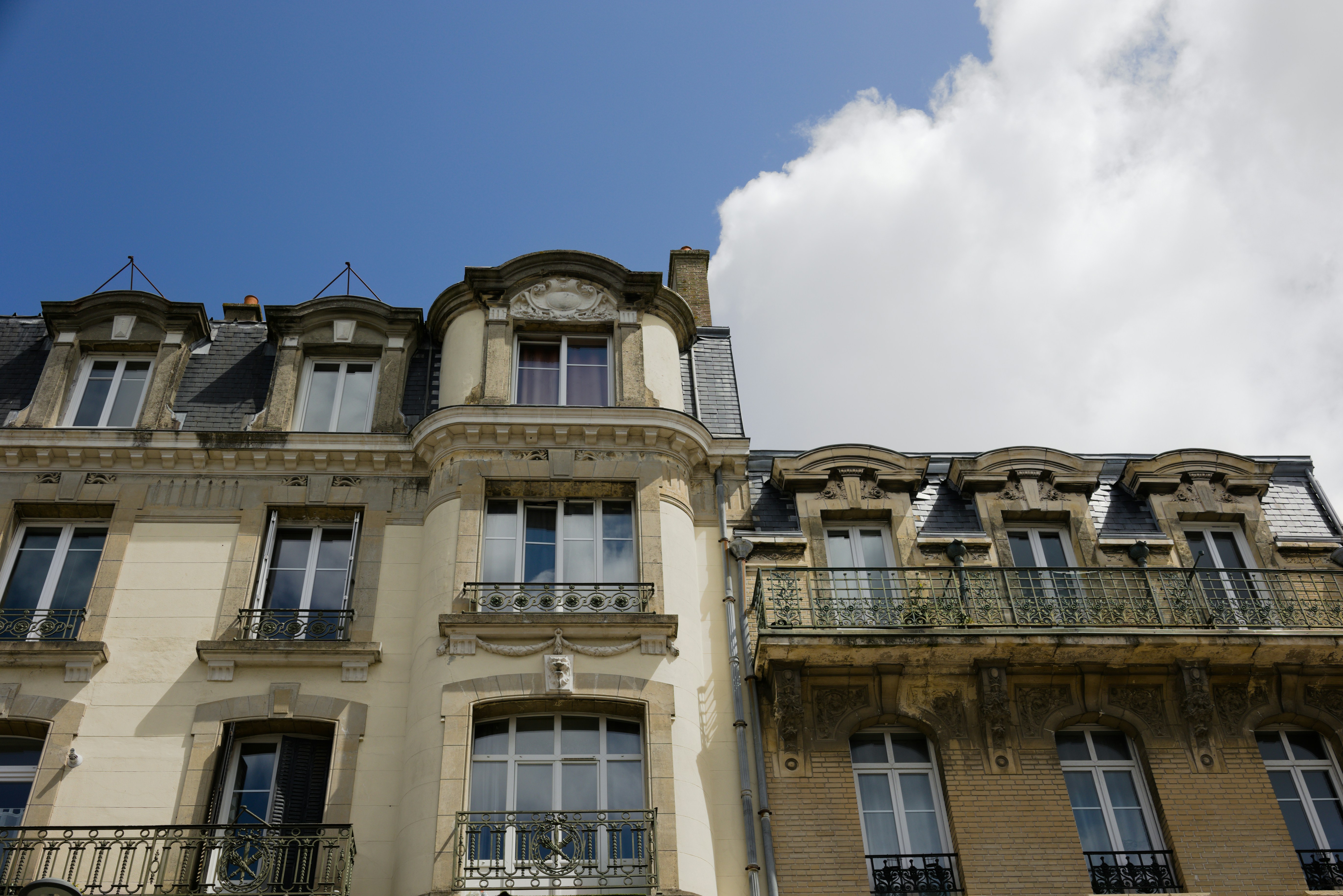 a tall building with balconies and balconies on top of it
