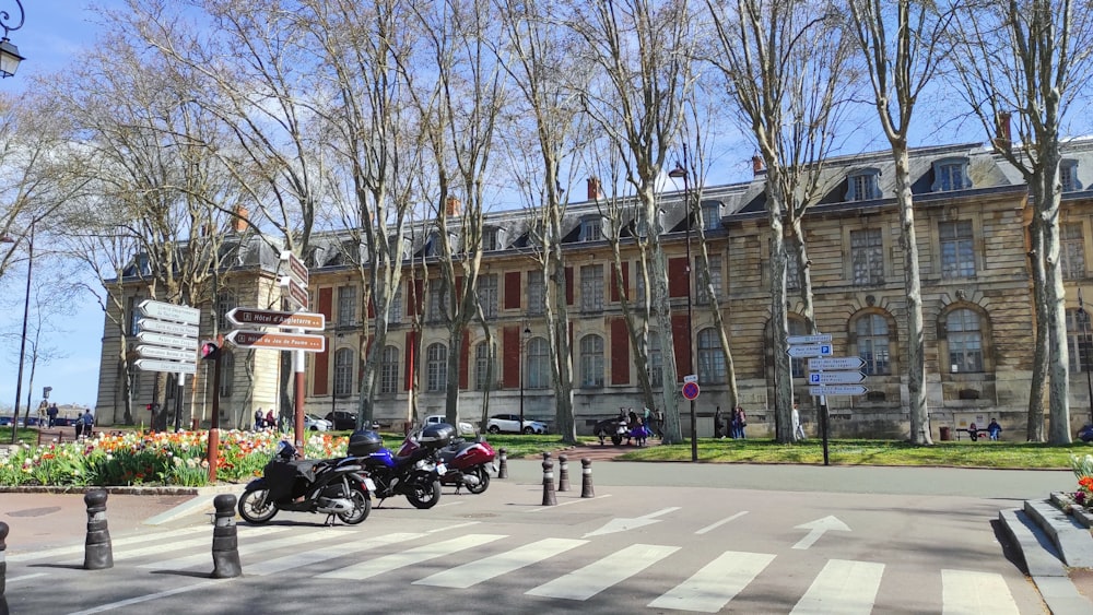 a group of motorcycles parked in front of a building