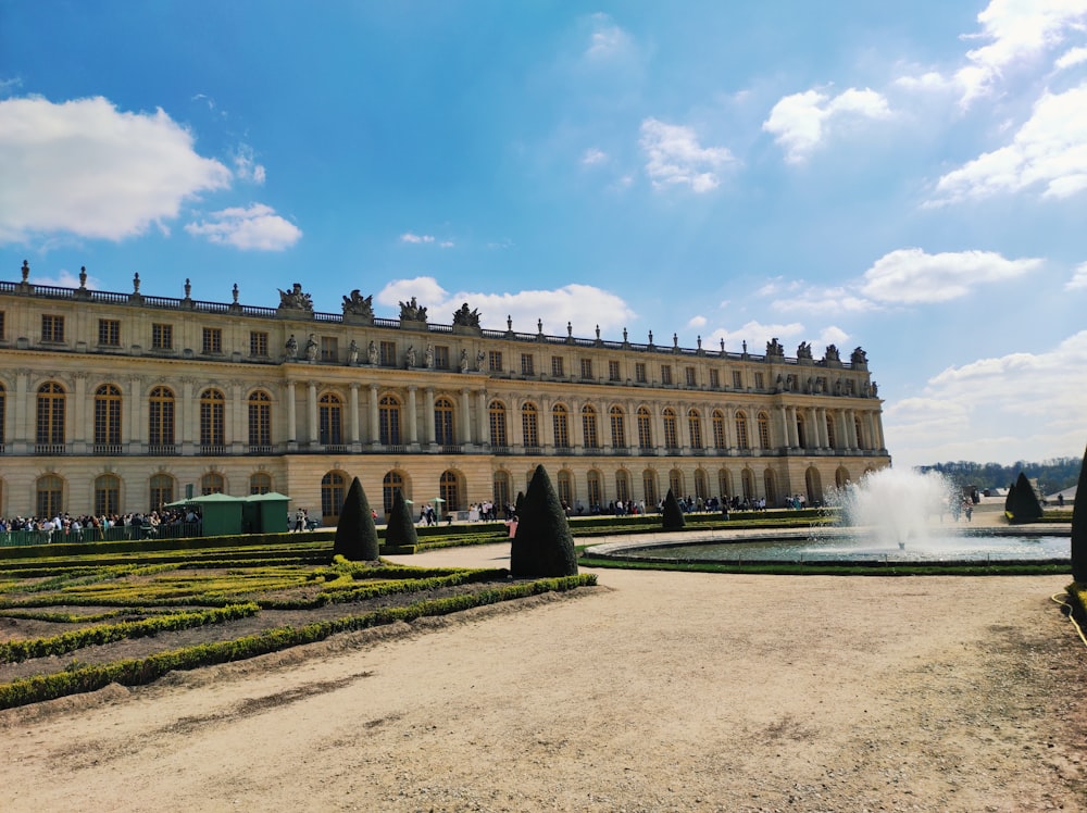 a large building with a fountain in front of it