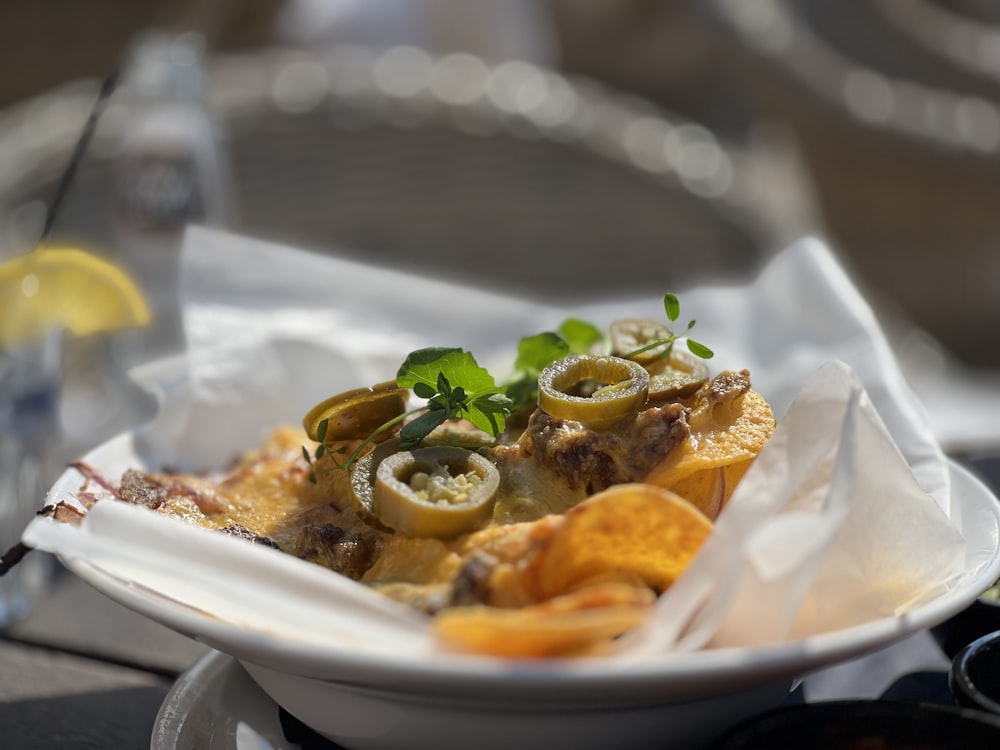 a white plate topped with food on top of a table