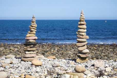 a pile of rocks sitting on top of a rocky beach