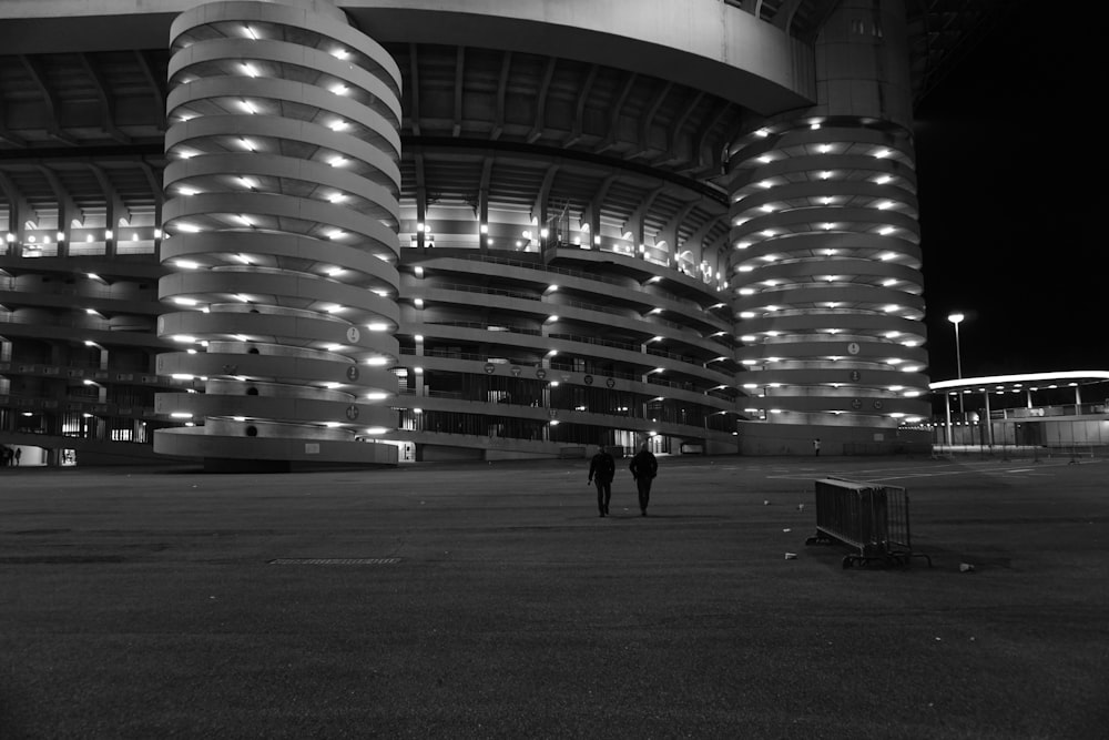 a couple of people that are standing in front of a building