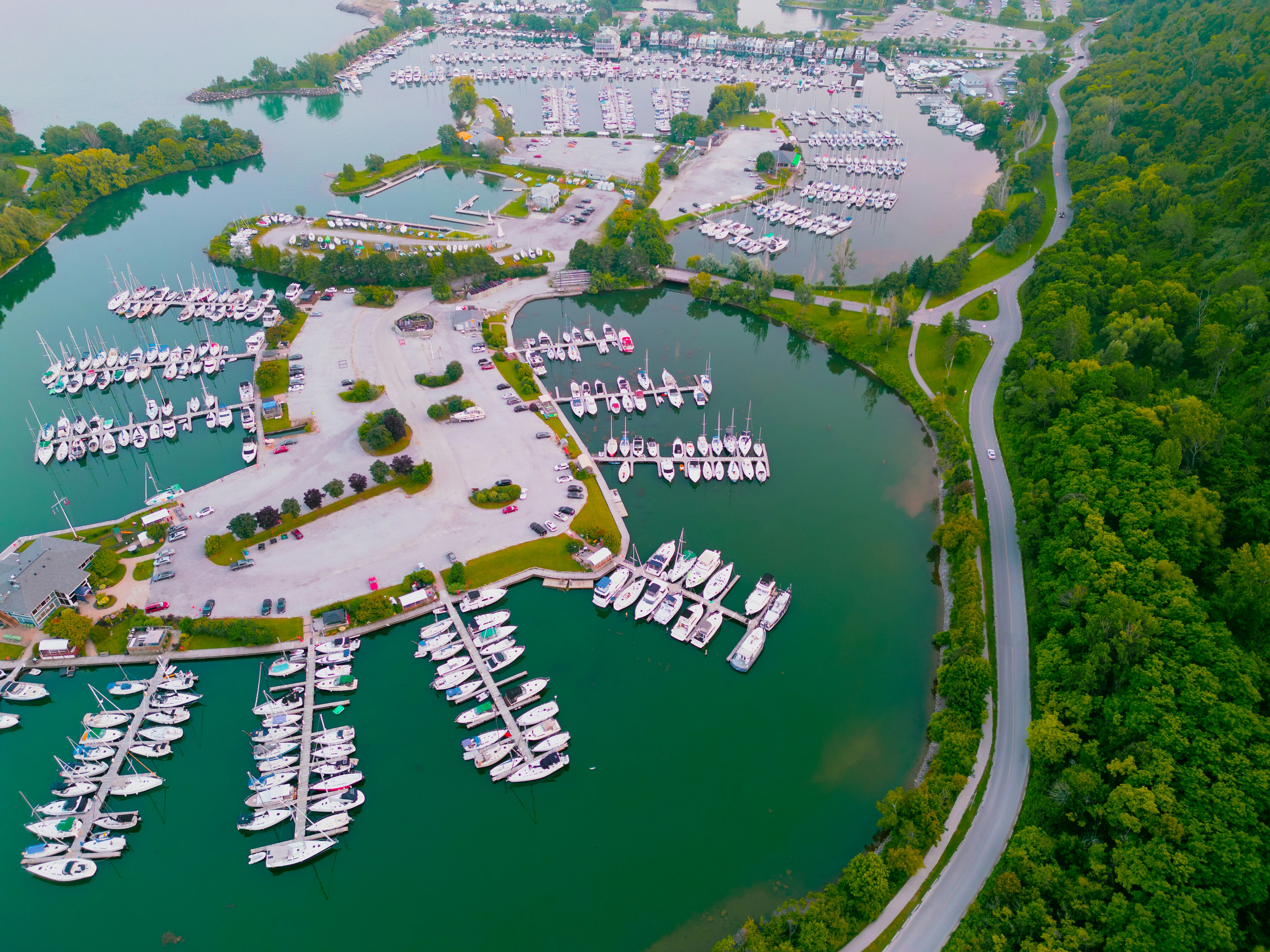 an aerial view of a marina with many boats