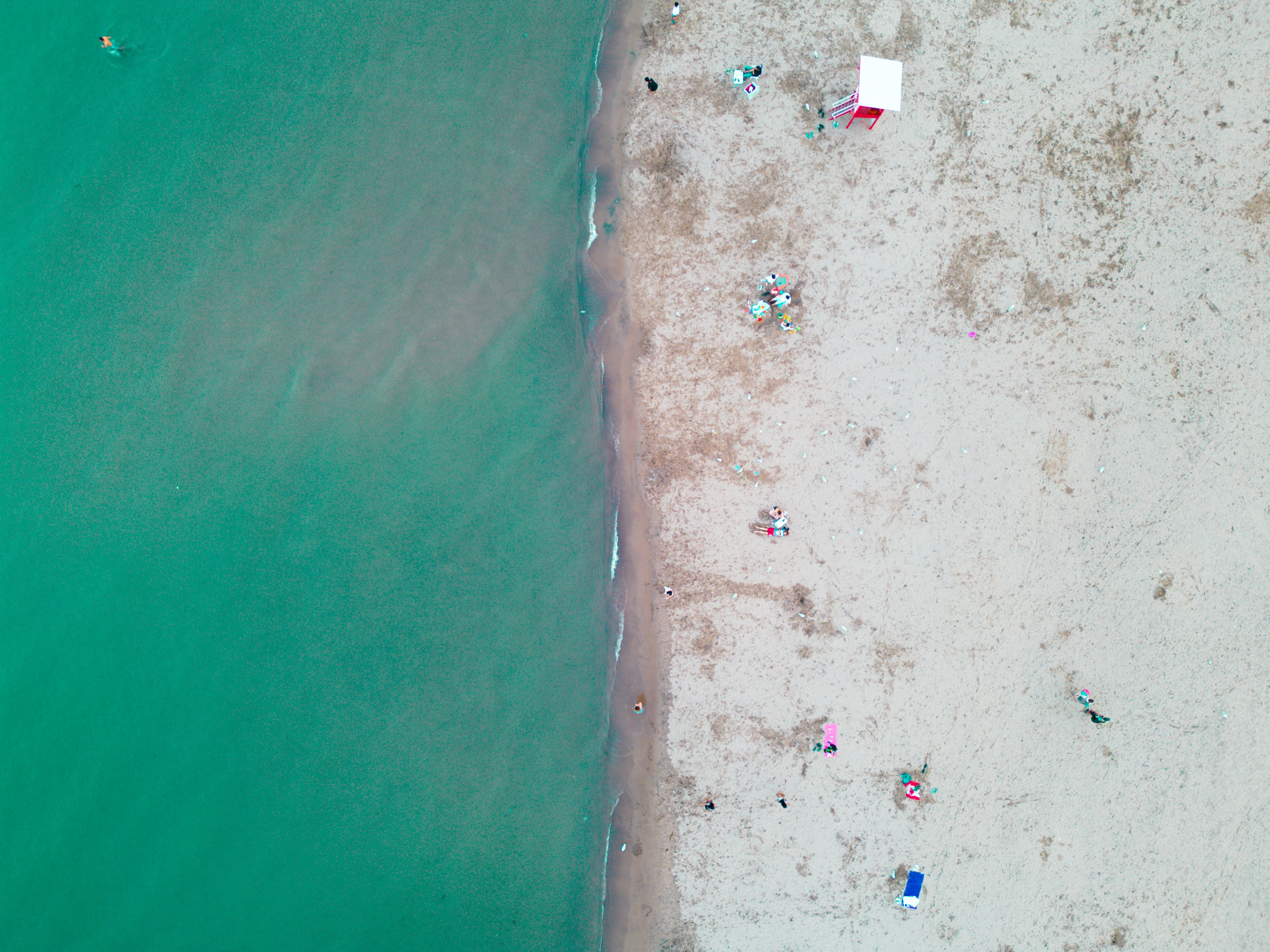 an aerial view of a beach with people on it, Bluffer