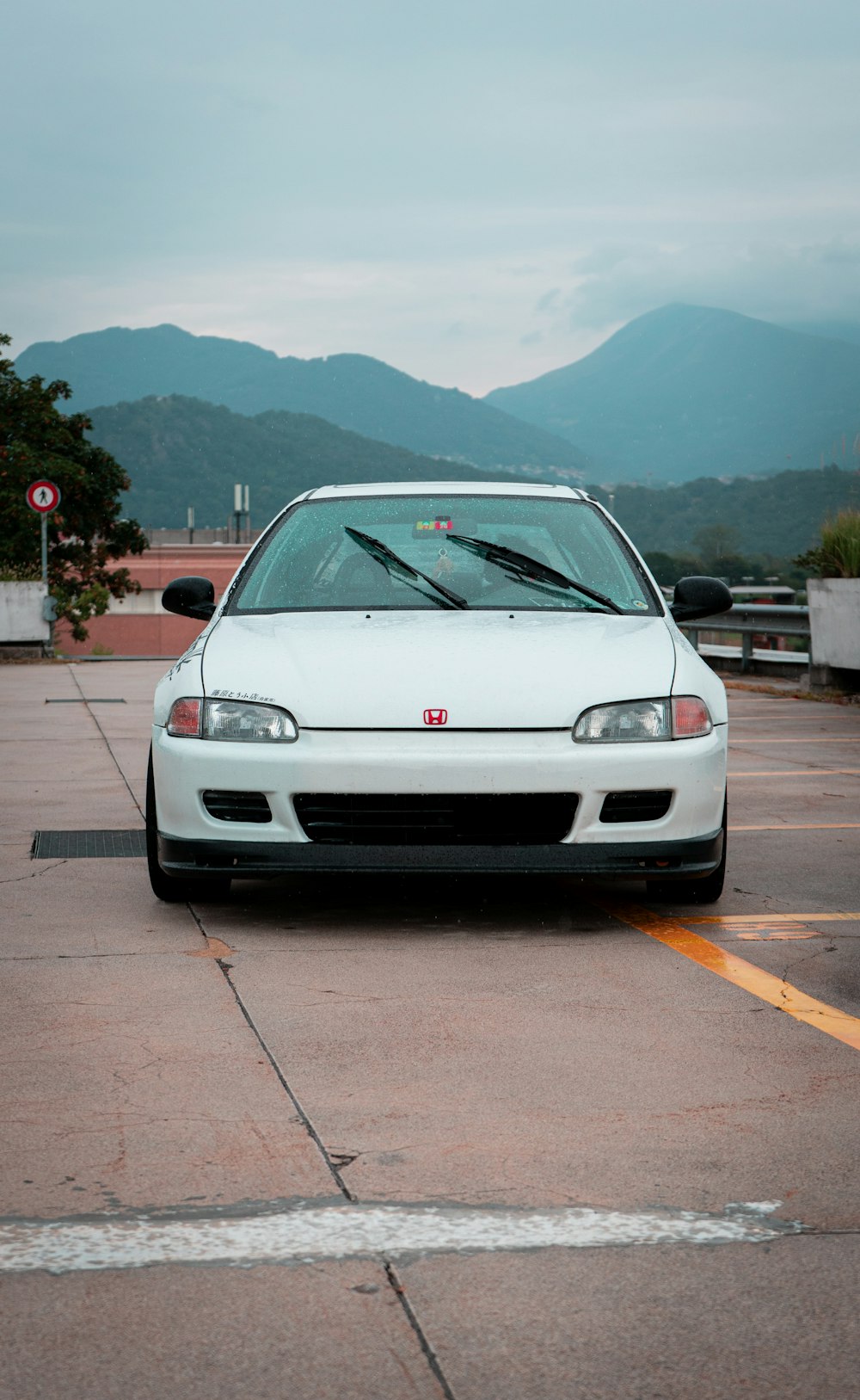 a white car parked in a parking lot