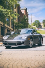 A sleek economy car parked on a sunny urban street.