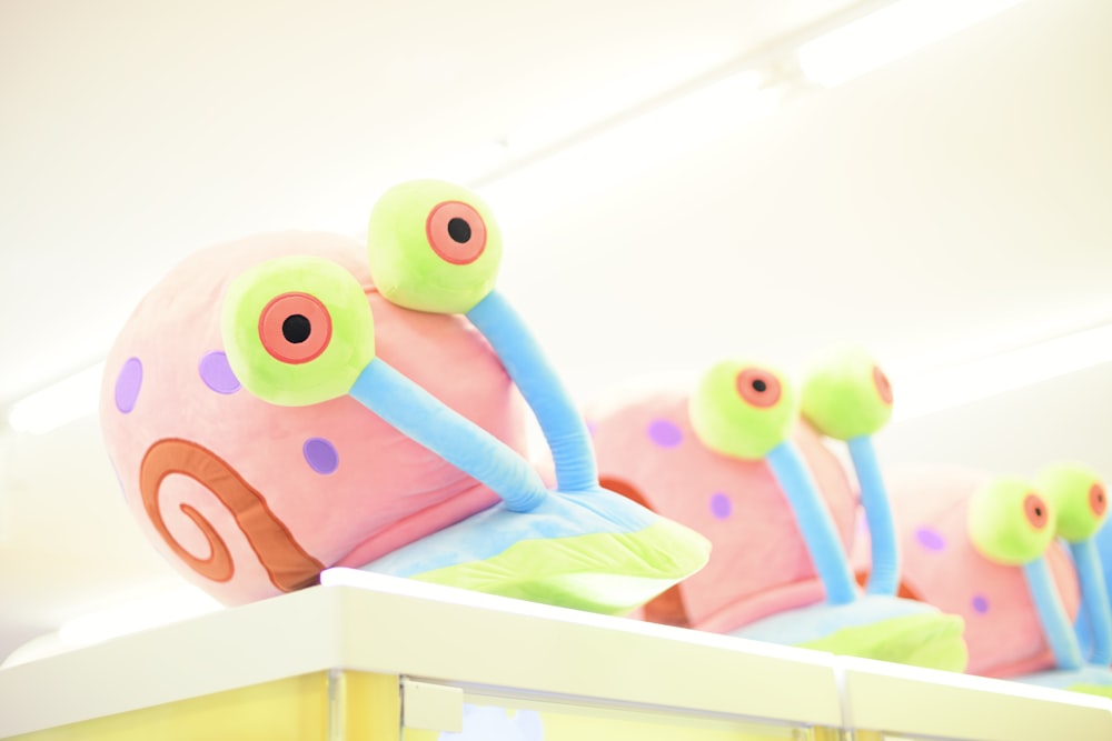 a group of toy cars sitting on top of a shelf