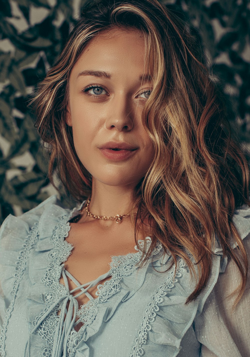 a close up of a person wearing a necklace