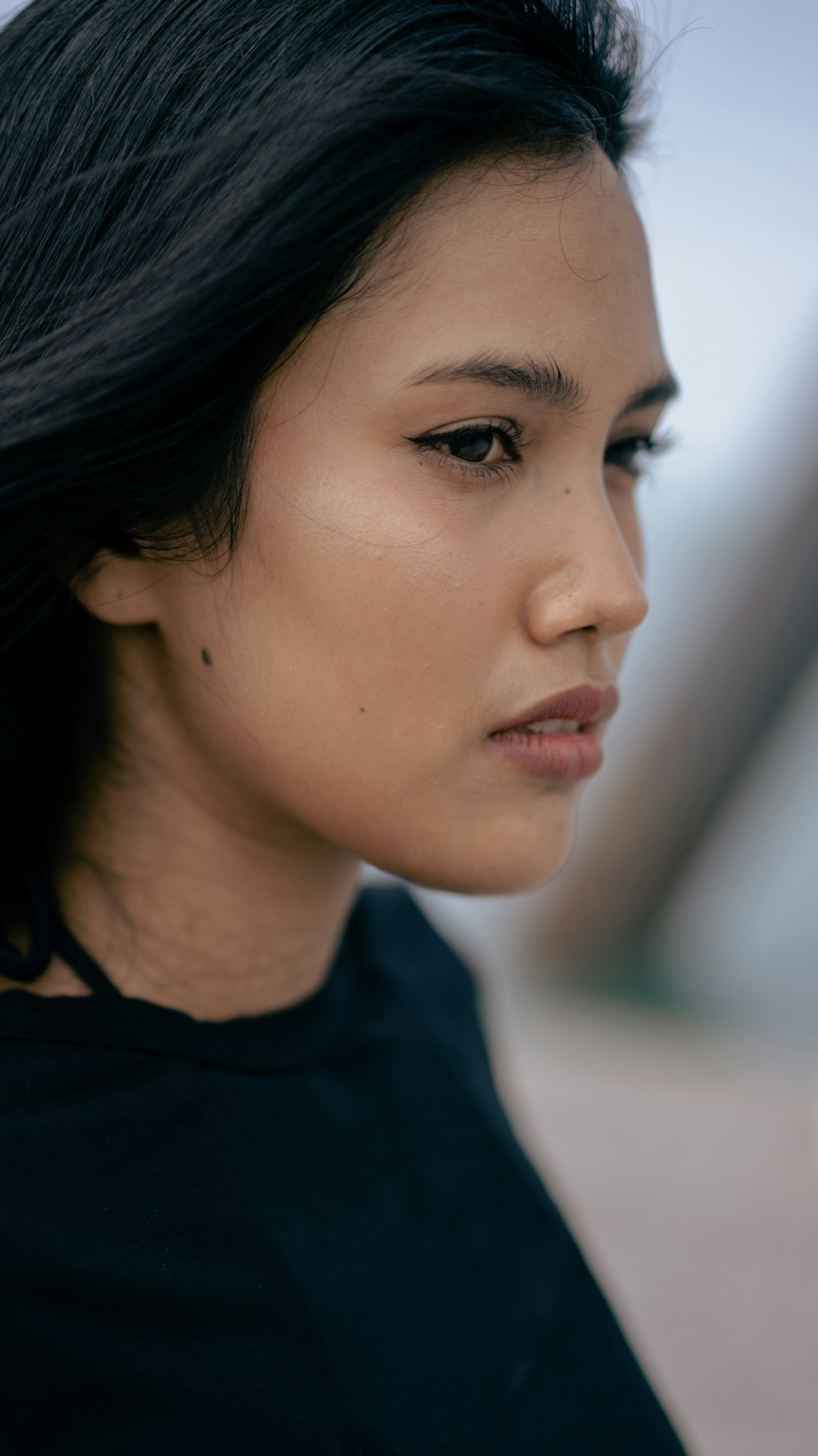a close up of a person wearing a black shirt