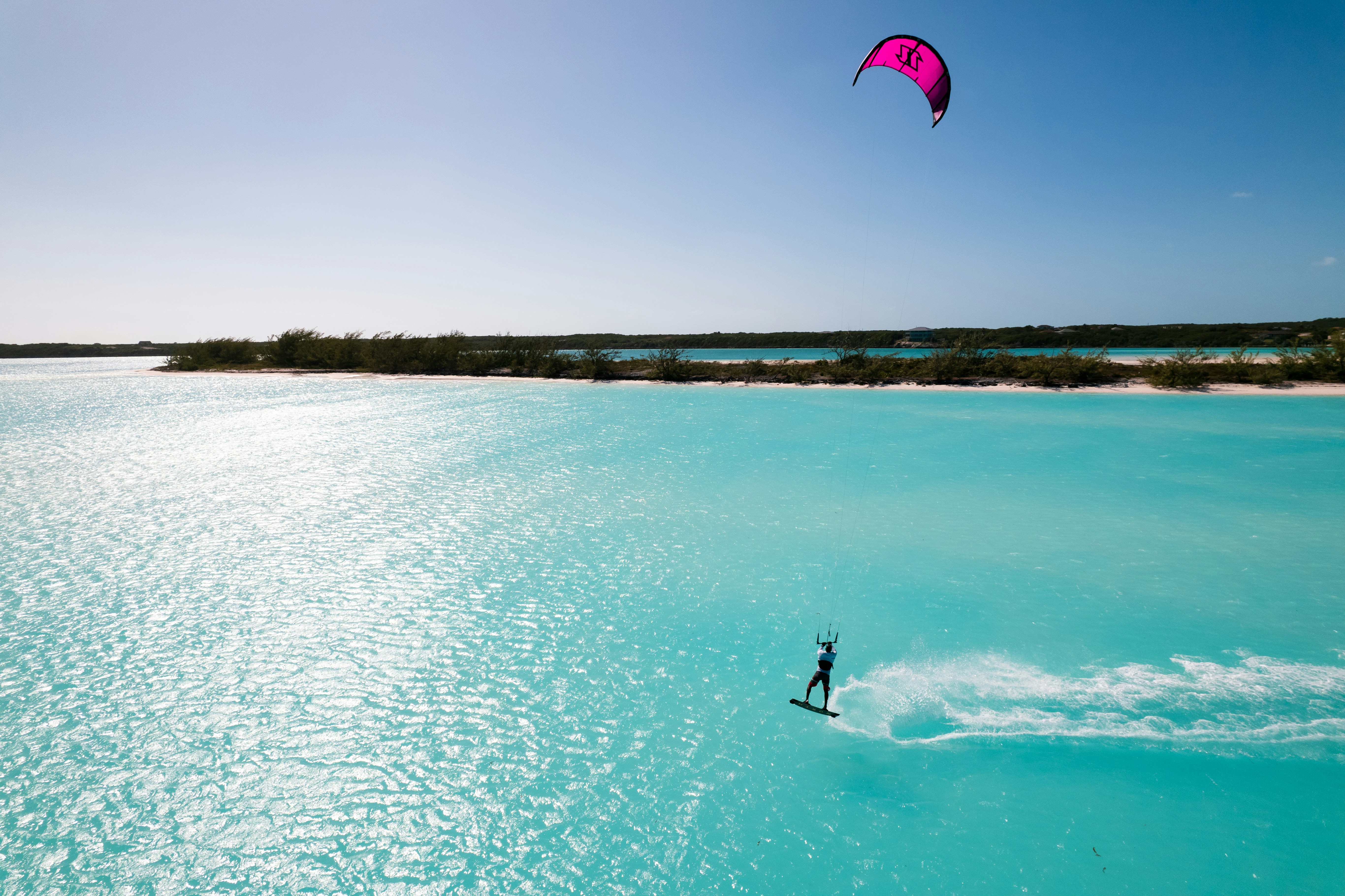 A person is para sailing in the blue water photo Free Exumas Image on