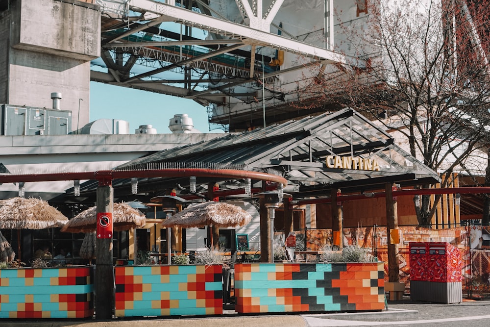 a colorfully painted food stand on a city street