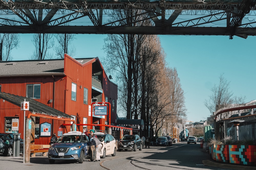 a street scene with cars parked on the side of the road