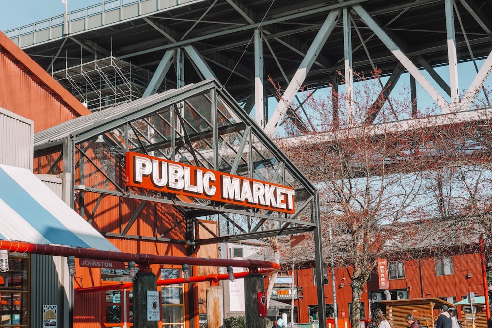 a public market with people walking around it