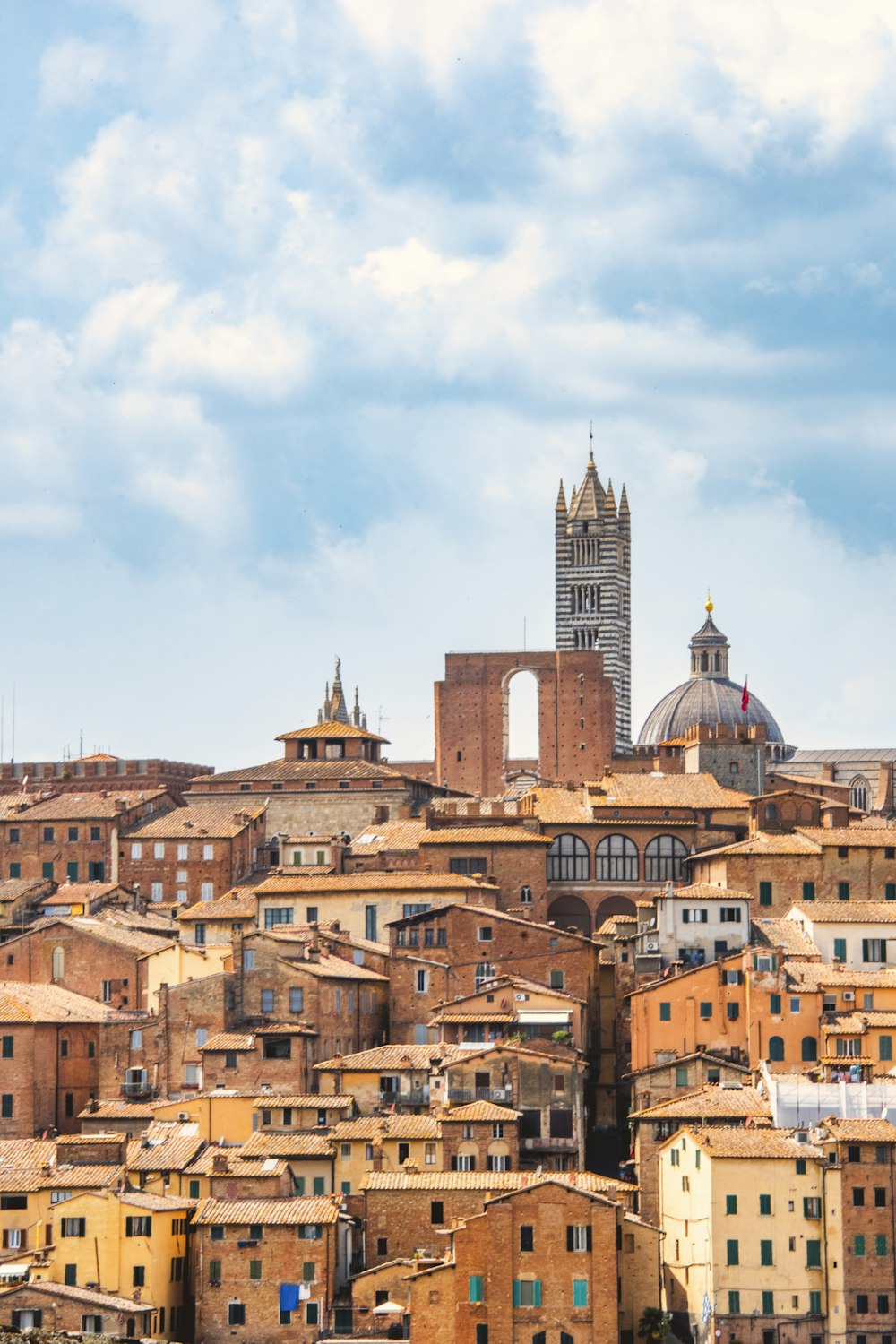 a view of a city with a clock tower in the background