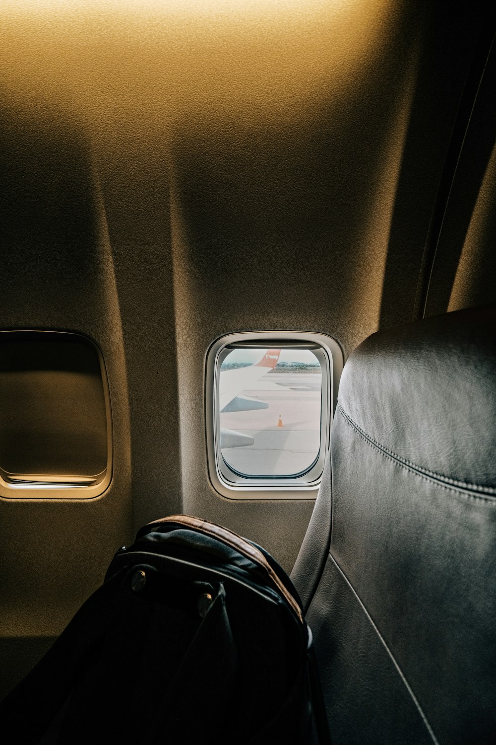 a seat in an airplane with a window
