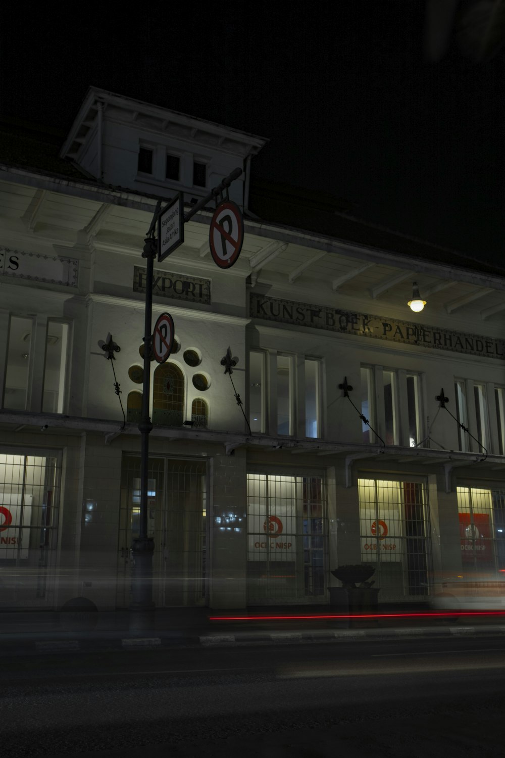 a building that has a street light in front of it