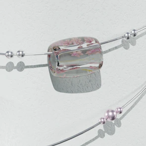 Elegant bracelet featuring moon phase charms displayed on a marble surface.