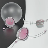 Delicate gold jewelry pieces styled with soft white and blush pink fabrics.