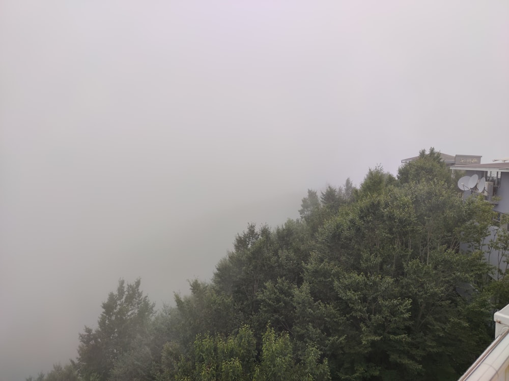 a foggy view of a house from a balcony