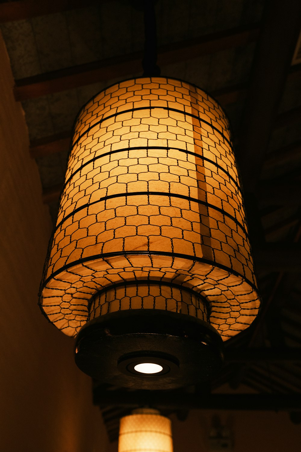 a lamp hanging from a ceiling in a room