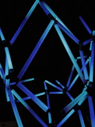 An abstract representation of interconnected nodes glowing with electric blue light.