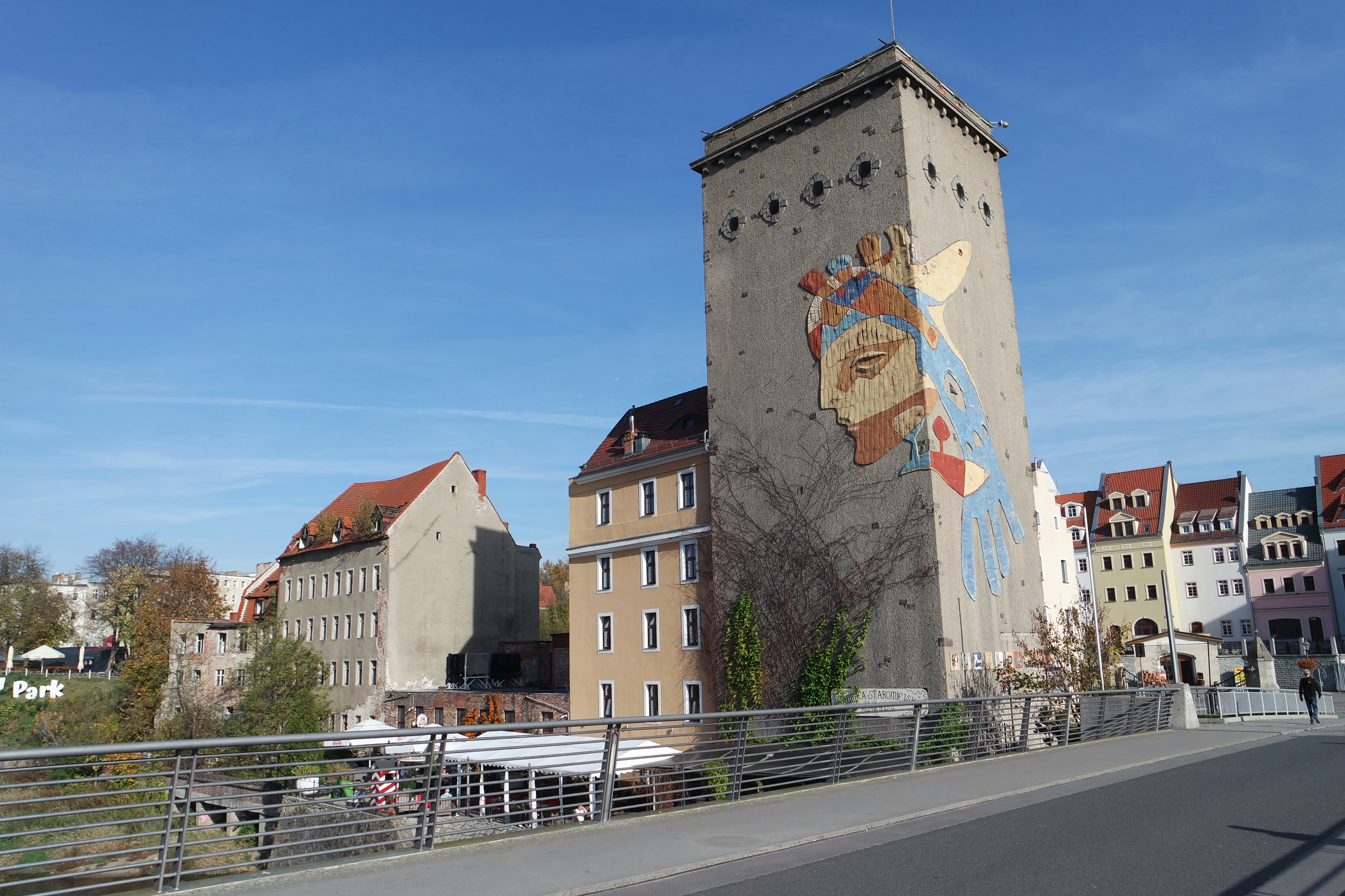 a tall building with a mural on the side of it