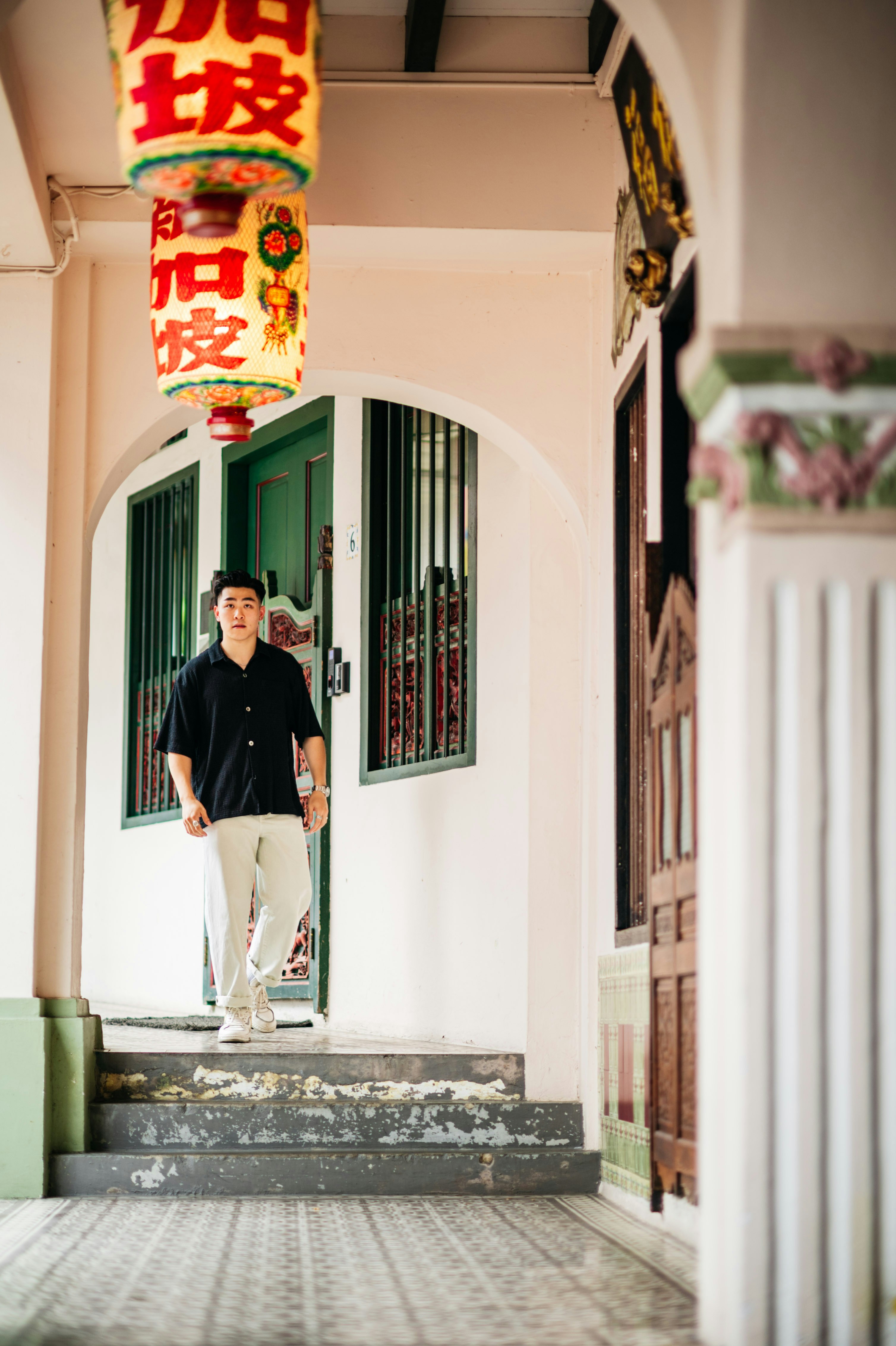 a man standing on the steps of a building