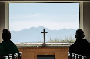 A serene moment of prayer and reflection in a beautiful setting.