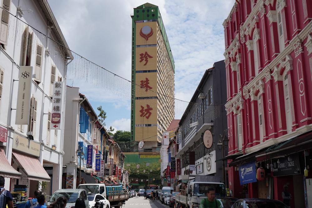 a city street with a tall building in the background