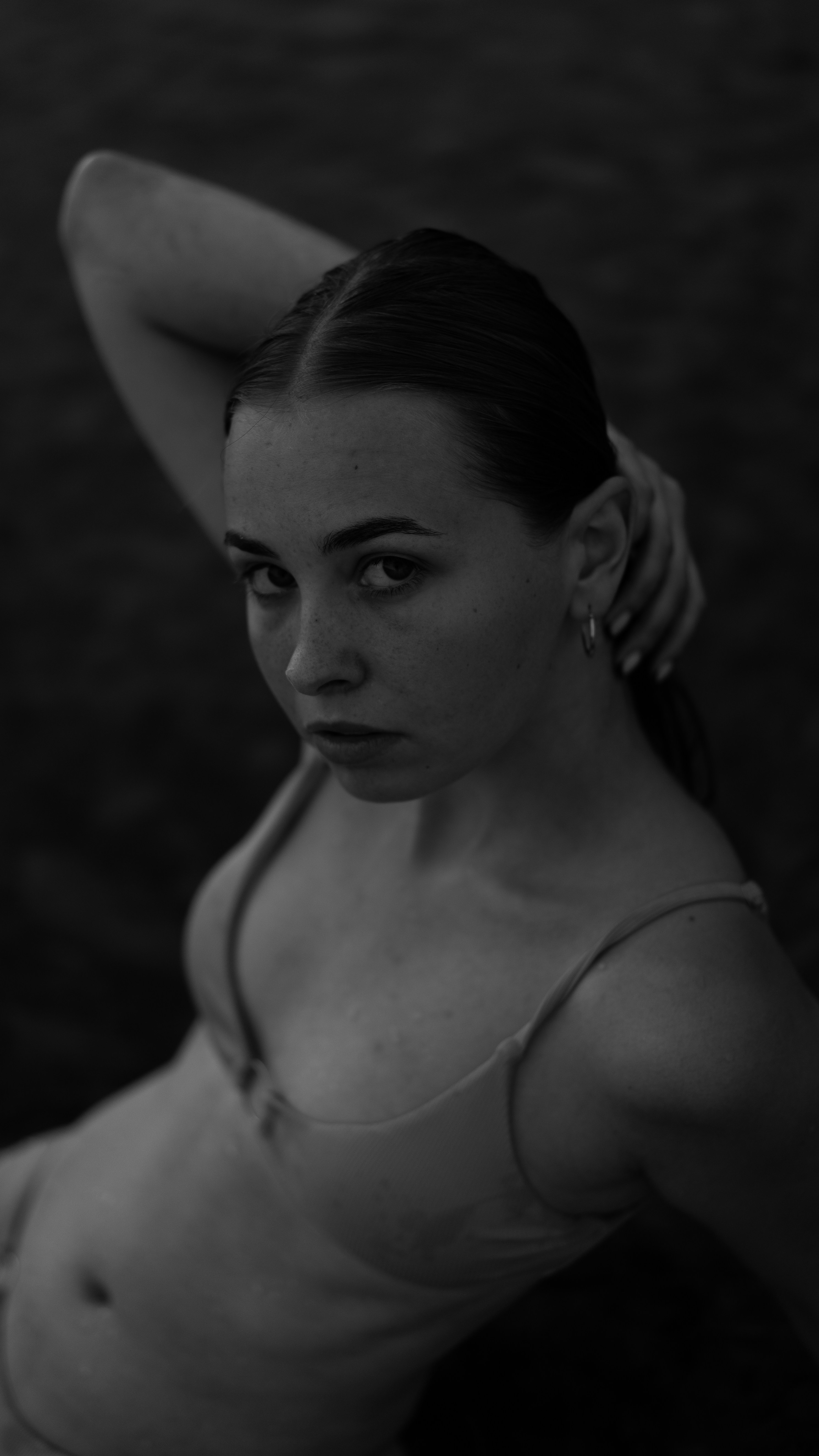 TIDELINE model in sculpted swimwear, high contrast studio portrait
