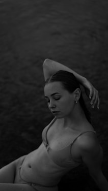 A confident Indian bikini model posing gracefully on a sunlit beach, embodying fitness and glamour.