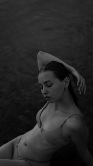 A confident Indian bikini model posing gracefully on a sunlit beach, embodying fitness and glamour.