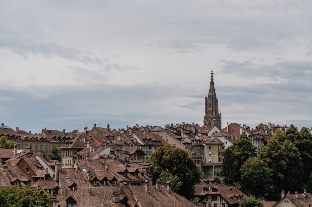 a view of a city with a church steeple in the background