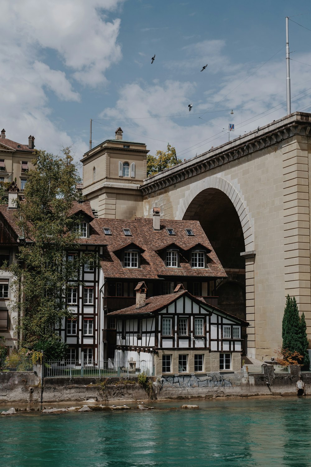 a large building sitting next to a body of water