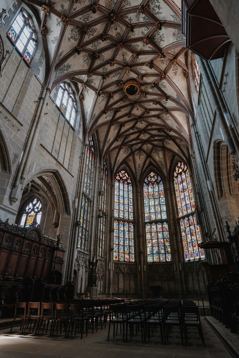 a large cathedral with stained glass windows and pews