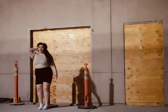 Close-up of hands shaking in front of a construction site background.