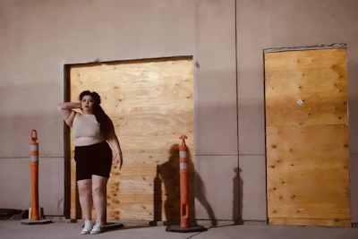 Close-up of hands shaking in front of a construction site background.