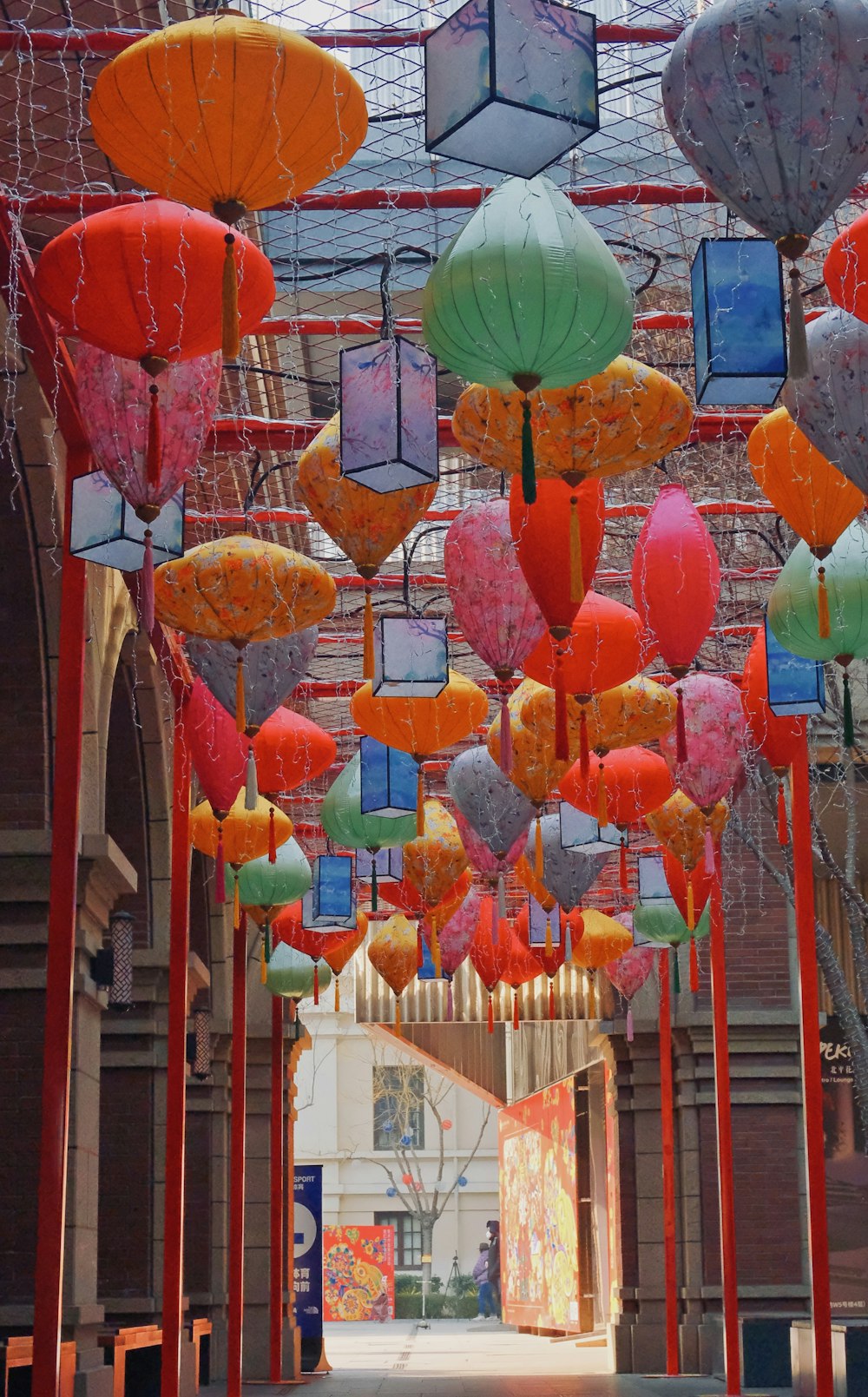 a bunch of umbrellas that are hanging from a ceiling