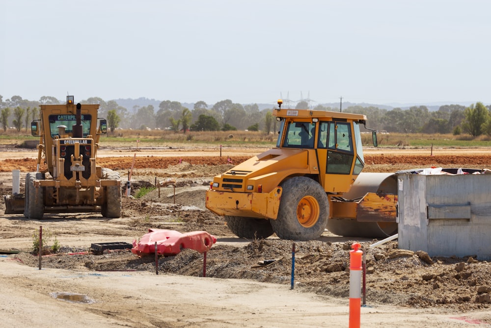 a bulldozer and a bulldozer on a construction site