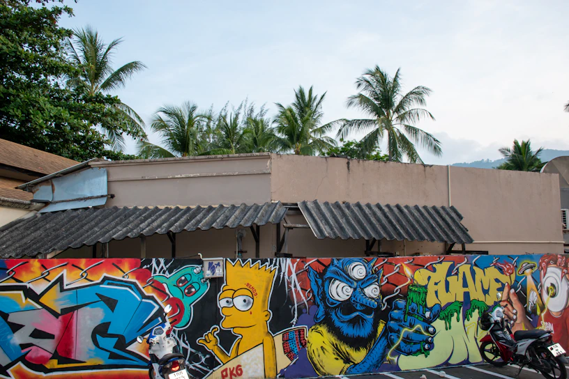 A vibrant mural of a classic TV character painted on an East London brick wall.