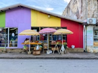 Volunteers setting up a colorful stall for the monthly producers' market.