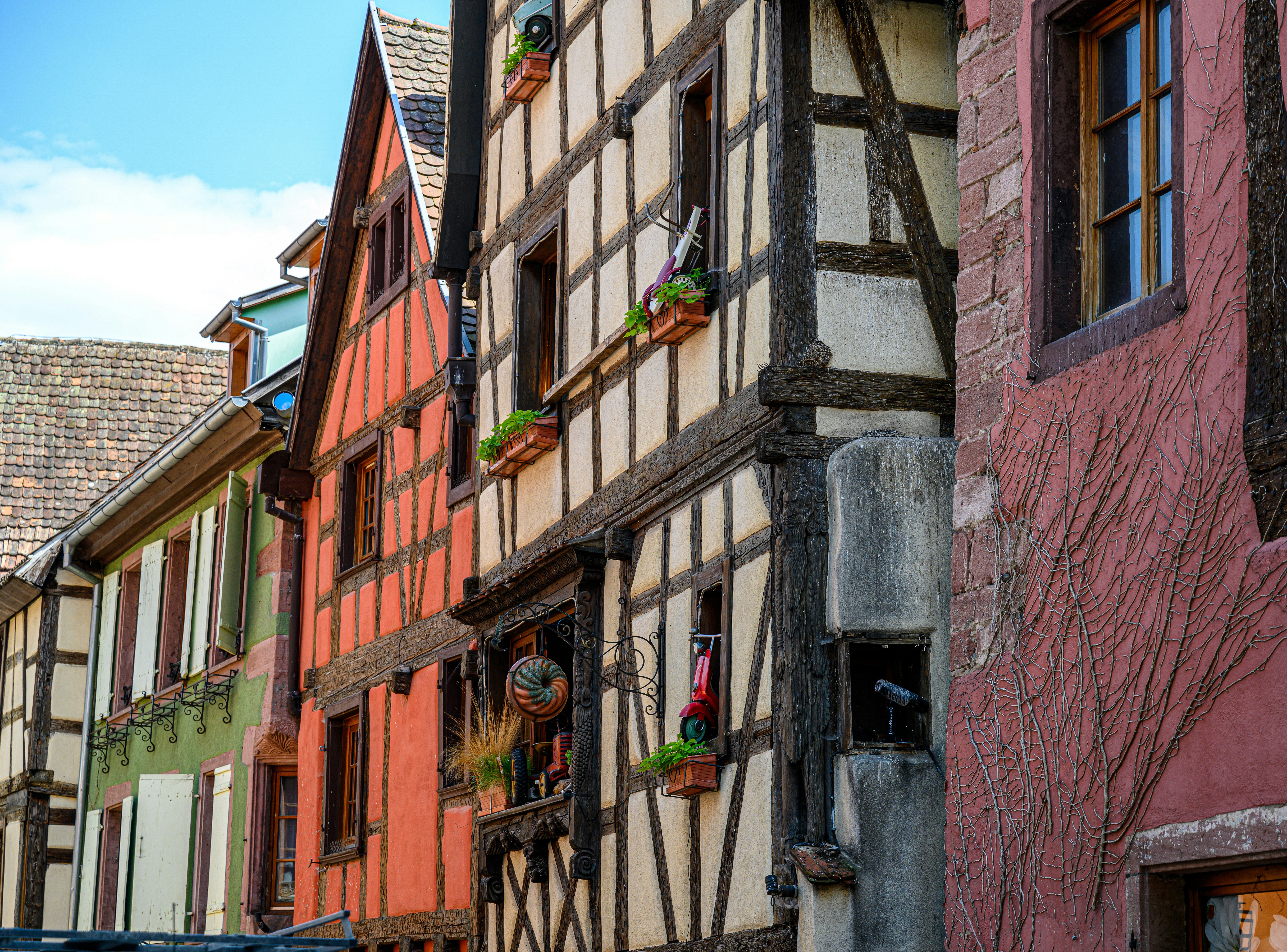 a row of old buildings with windows and shutters