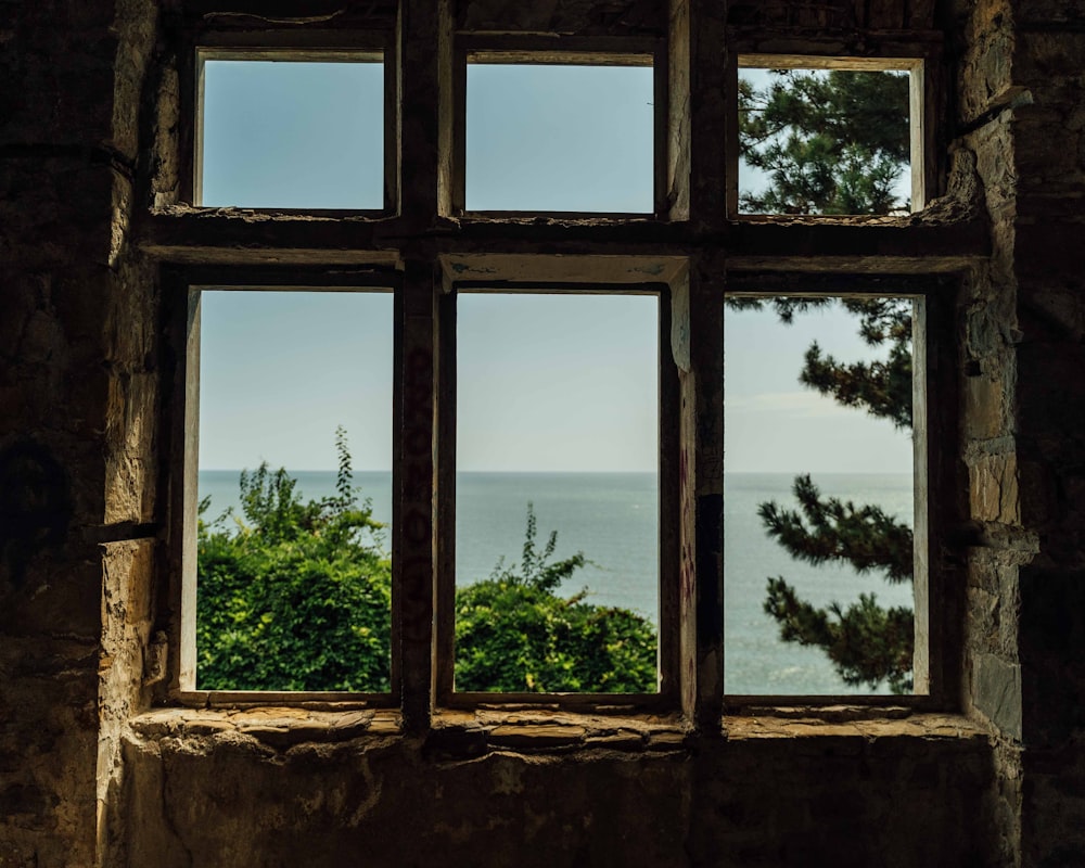 a window with a view of the ocean