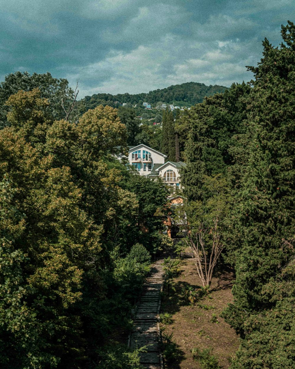 a house in the middle of a wooded area