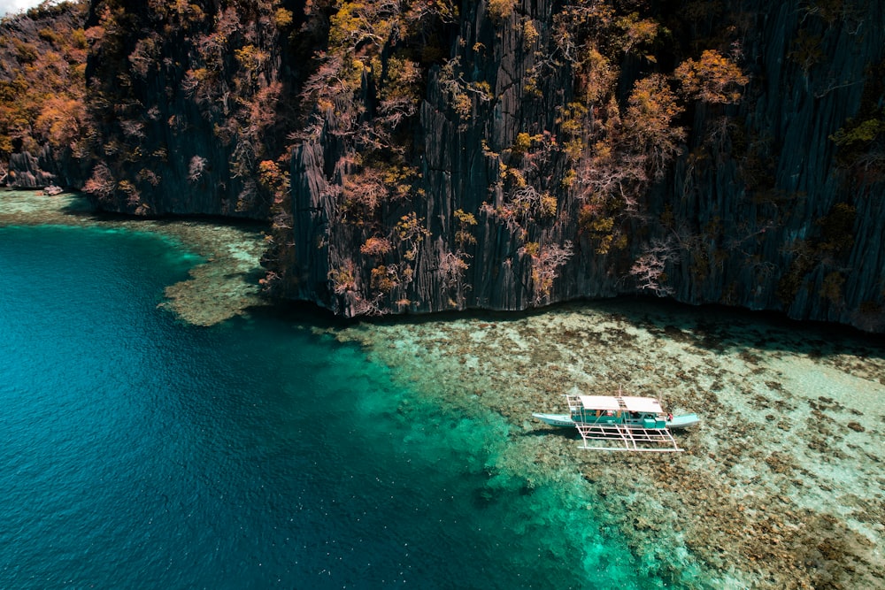 a boat floating on top of a body of water